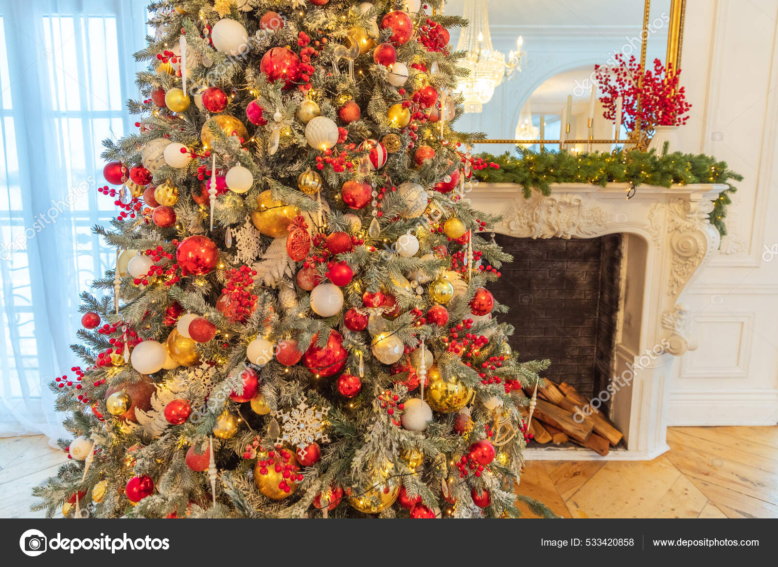 Classic Christmas decorated interior room, New year tree with red and gold  decorations. Modern white classical style interior design apartment with  fireplace and Christmas tree. Christmas eve at home. Stock Photo by ©